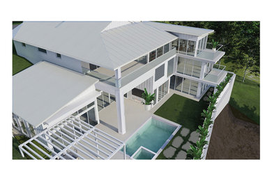 Foto de fachada de casa blanca y gris costera extra grande de tres plantas con revestimiento de madera, tejado a cuatro aguas, tejado de metal y panel y listón