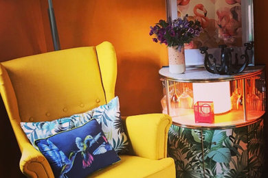 Bright walls, upcycled drinks cabinet and reading chair