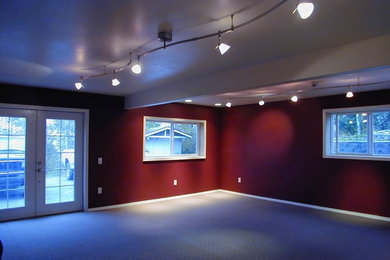 Inspiration for a mid-sized contemporary enclosed carpeted and beige floor game room remodel in Other with red walls, no fireplace and no tv