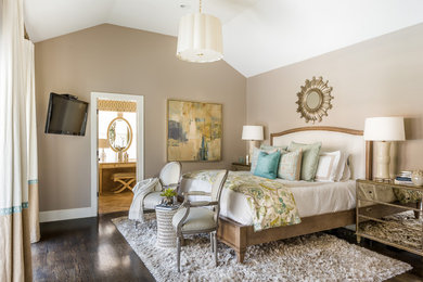 This is an example of a mid-sized transitional master bedroom in Austin with beige walls and dark hardwood floors.