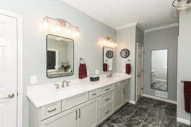 Mid-sized transitional 3/4 white tile and porcelain tile porcelain tile, black floor and double-sink bathroom photo in Atlanta with beaded inset cabinets, gray cabinets, a two-piece toilet, gray walls, an undermount sink, quartz countertops, a hinged shower door, white countertops and a built-in vanity