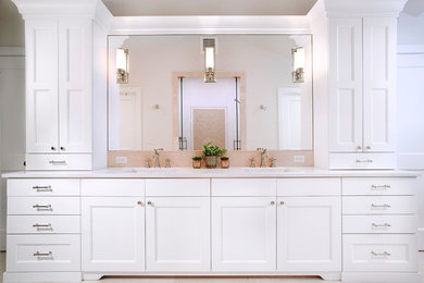 Inspiration for a mid-sized timeless master beige tile and stone slab porcelain tile and beige floor alcove shower remodel in Denver with shaker cabinets, white cabinets, beige walls, an undermount sink, quartzite countertops and a hinged shower door