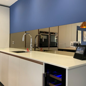 Modern grey, blue and copper kitchen and utility