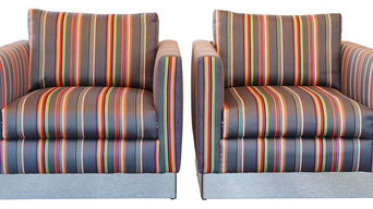 Club chairs reupholstered in Paul Smith fabric