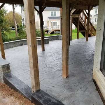 C-Stamped concrete patio with a wall