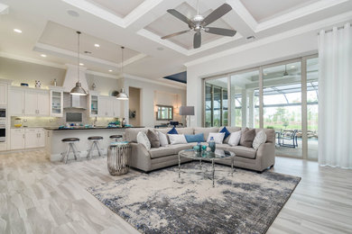Example of a large trendy formal and open concept porcelain tile and gray floor living room design in Miami with gray walls, no fireplace and no tv