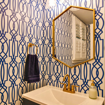 Vibrant Powder Room with Bold Blue Geometric Wallpaper