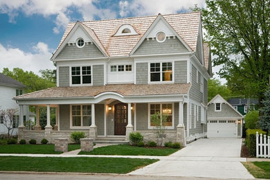 Mid-sized traditional three-storey grey exterior in Chicago with wood siding and a gable roof.