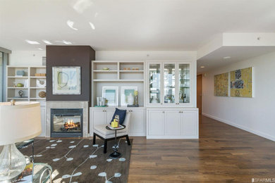 Living room - mid-sized contemporary open concept dark wood floor and brown floor living room idea in San Francisco with white walls, a standard fireplace, a stone fireplace and no tv