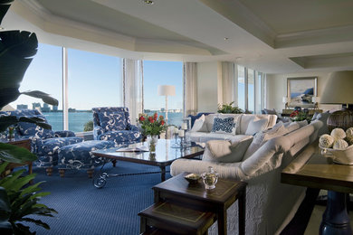 Living room - large transitional open concept living room idea in Tampa with beige walls and no fireplace