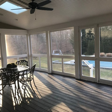 Traditional Screened in deck and fireplace