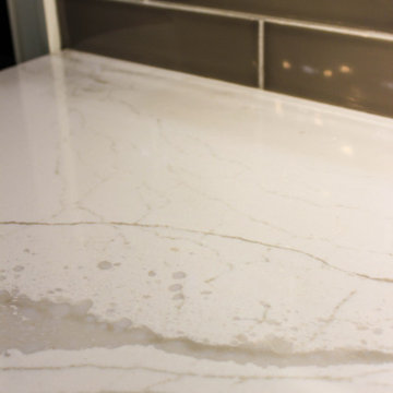 White Kitchen with Espresso Island, Galley Sink, Cambria Britannica Countertop