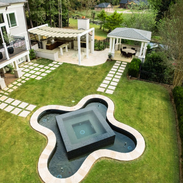 Contemporary Backyard Oasis with Architectural Water Feature & Outdoor Pavilion