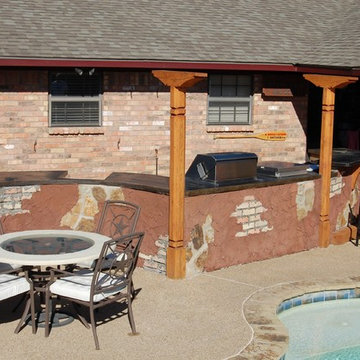 wOutdoor kitchen with artistic carved wooden posts