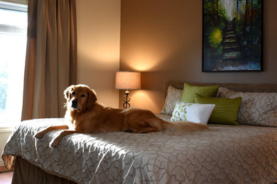 Example of a small transitional master medium tone wood floor bedroom design in Toronto with beige walls