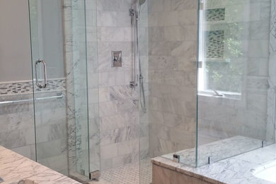 Inspiration for a mid-sized transitional master bathroom in New York with an alcove shower, gray tile, white tile, marble, grey cabinets, an undermount tub, an undermount sink, marble benchtops, slate floors and grey walls.