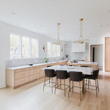 Glencoe Natural Kitchen With Floor-to-Ceiling Millwork and Quartz Slab Elegance