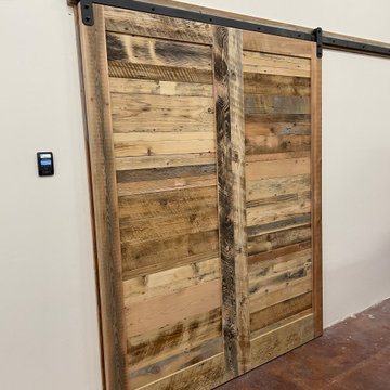 Man Cave- Reclaimed wood walls, rusty metal, barn doors