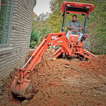 Excavating and Reshaping for a Retaining Wall