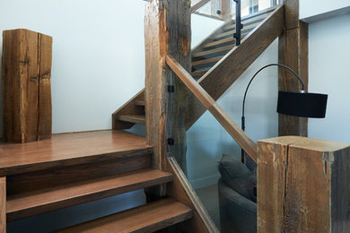 Mid-sized minimalist wooden l-shaped glass railing staircase photo in Edmonton