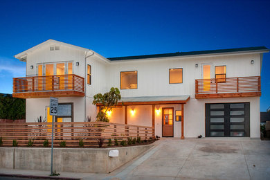 Inspiration for a large country white two-story concrete fiberboard exterior home remodel in San Diego with a shingle roof