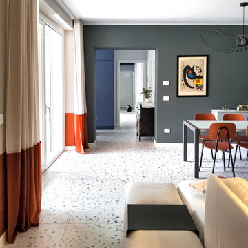 Oasi colorata: soggiorno e cucina tra Blu, Verde e Arancio