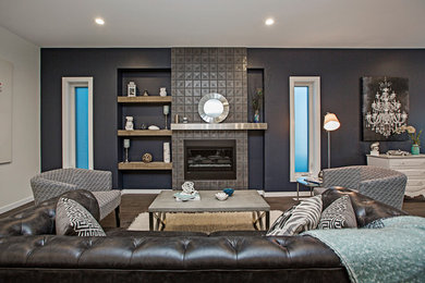 Mid-sized contemporary open concept living room in Edmonton with blue walls, medium hardwood floors, a ribbon fireplace, a tile fireplace surround, a wall-mounted tv and brown floor.