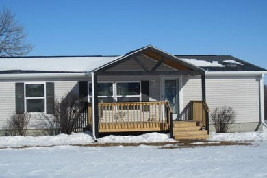 Inspiration for a mid-sized deck remodel in Omaha with a roof extension