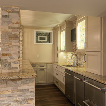 Basement Showing Warm Colors, Straight Lined Cabinets and Stacked Stone