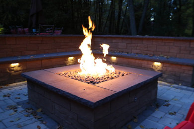 Patio - contemporary backyard concrete paver patio idea in Boston with a fire pit