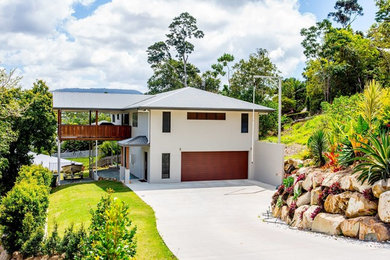 Photo of a modern home design in Townsville.