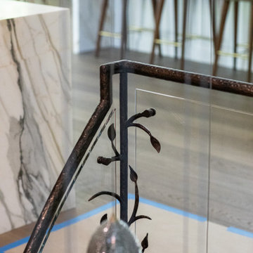 NATURE'S EMBRACE OF IRON AND GLASS RAILING