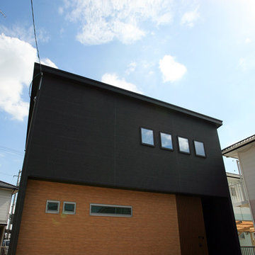 吹抜けが中心の家族想いの家