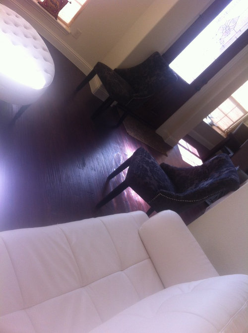 Living room with bay windows and corner fireplace