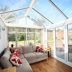 White Conservatory with PVCu Bi-Fold Doors - Products