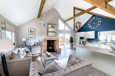 Inspiration for a medium sized nautical open plan living room in Other with a wood burning stove, a brick fireplace surround and grey floors.