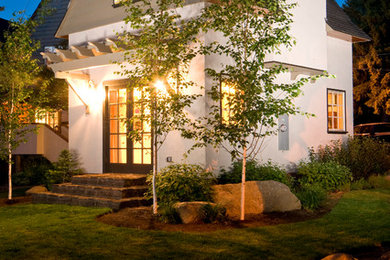 Example of a classic two-story exterior home design in Portland