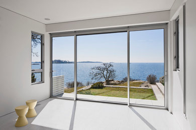 Minimalist gray floor home yoga studio photo in New York