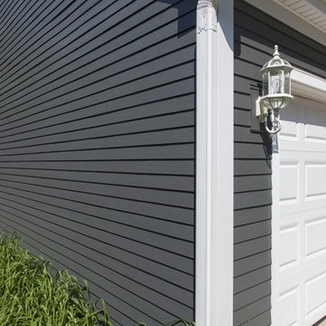 Home transformed with James Hardie Iron Gray Siding & new windows in Wheaton IL