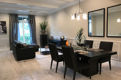Inspiration for a mid-sized modern open concept ceramic tile and gray floor living room remodel in Miami with gray walls and a wall-mounted tv