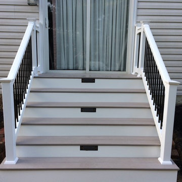 Azek landing, stairs w/ riser lighting & white vinyl railing system