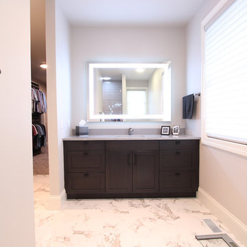 His and Hers Master Bathroom with Separate Showers and Vanity Areas