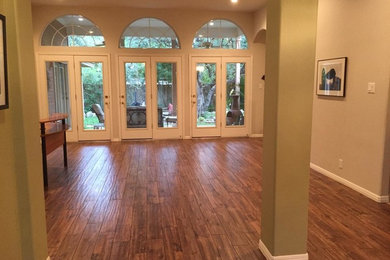 Family room - traditional porcelain tile family room idea in Austin