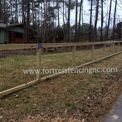 simple post and frame fence with black vinyl coated wire insert - Home Fencing And Gates