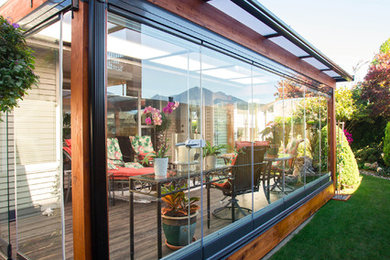 Sunroom - mid-sized tropical vinyl floor sunroom idea in Vancouver