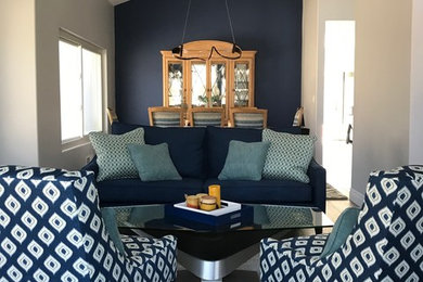 Living room - large transitional enclosed and formal medium tone wood floor and gray floor living room idea in Los Angeles with gray walls, no fireplace and no tv