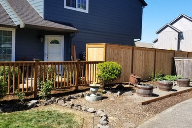 Design ideas for a large transitional full sun front yard gravel driveway in Seattle.
