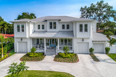 Example of a beach style home design design in Tampa