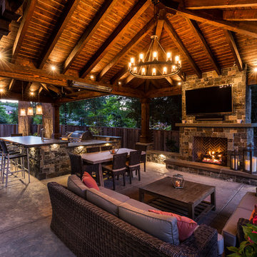 a Loggia with an Outdoor Kitchen and Living Room