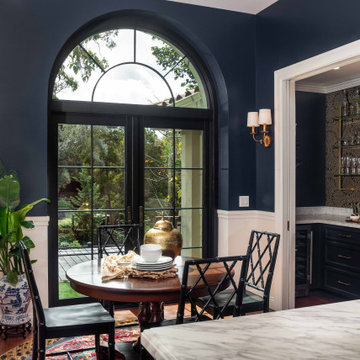 Traditional Breakfast Nook with Arched Black French Doors and Navy Walls